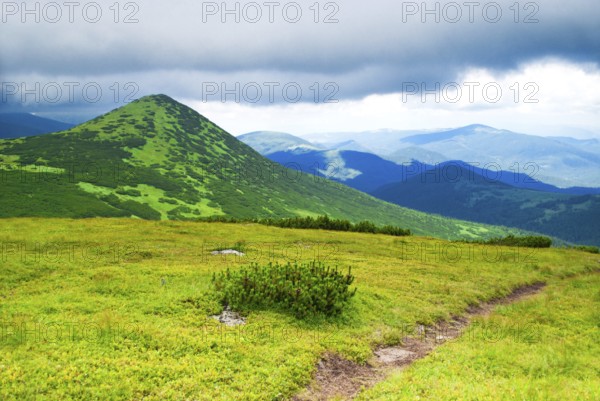 Path in mountains in storm day