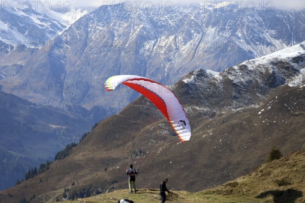 A paraglider takes off in the hiking paradise and holiday region of South Tyrol / Alto Adige on the Roßkopf, Gossensass Pflersch, Italy, Europe