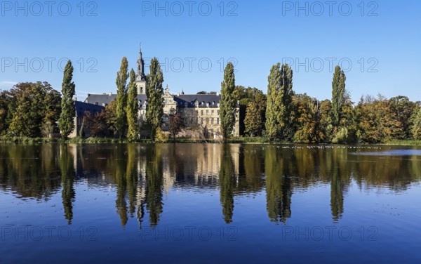 The Abbey of the Park reflecting in the pond in Leuven, Belgium, Europe