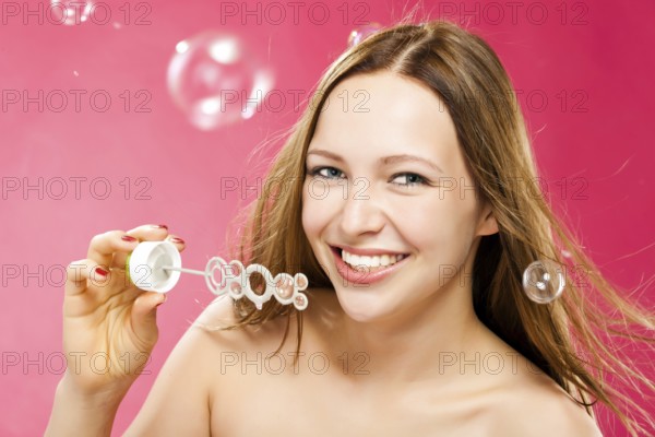 Beauty and health of a young woman on a red background