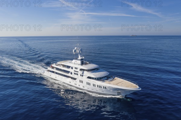 Aerial view 74 metre motor yacht AURORA, delivered in 2017 by the German shipyard Lürssen Yachts, Design Winch Design, sailing past Roquebrune Cap Martin in the morning to the Principality of Monaco, Cote d'Azur, Mediterranean Sea