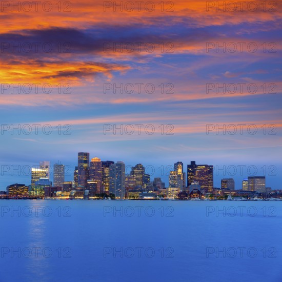 Boston skyline at sunset and river reflection in Massachusetts USA