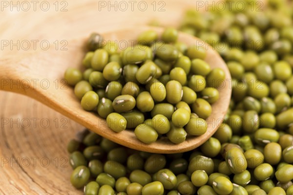 Mung beans over wooden spoon, lodz, poland