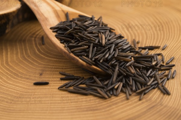 Wild rice on wooden spooon