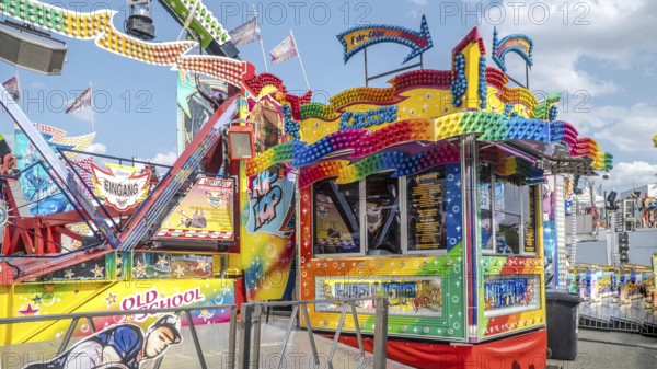WIESBADEN, HESSE, Germany - 07-03-2023- Front of checkout cabin of a fairground ride with colourful lamps at the German American Friendship Festival in Wiesbaden