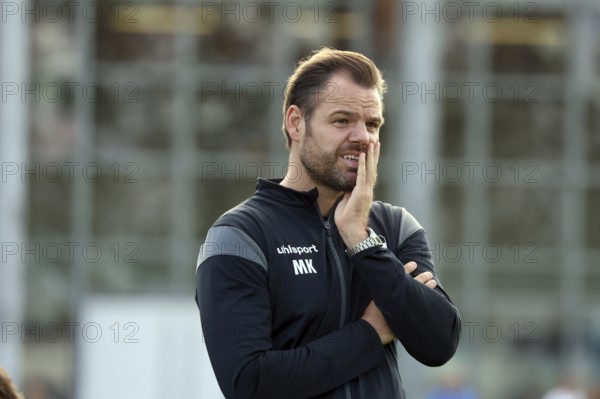 Mario Klotz (head coach FC 08 Villingen) watches his team's match in the SBFV Cup round of 16 23/24: VfR Hausen- - FC 08 Villingen, Hausen an der Möhlin, Germany / Germany with a frown on his face