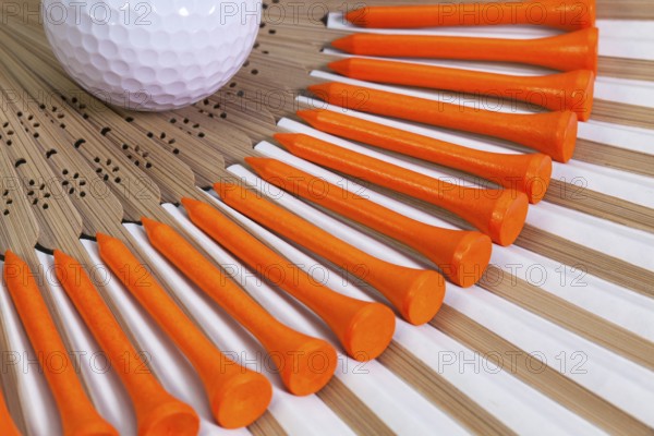Typical Japanese hand fan made of bamboo and golf equipments