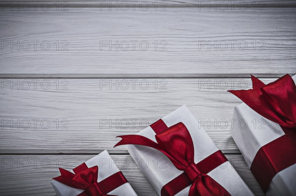 Gift boxes on wooden board holidays concept