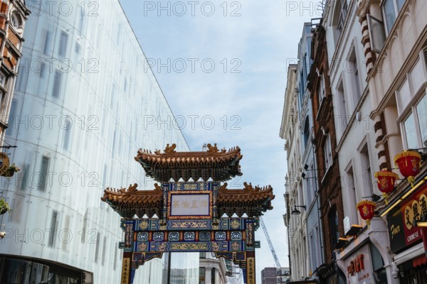 London, UK, May 15, 2019: View of the entrance to London Chinatown with Chinese restaurants, bakeries and souvenir shops in Soho area