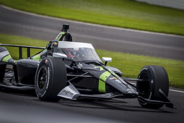 ROMAIN GROSJEAN (77) of Geneva, Switzerland comes off turn 3 during a practice for the 108th Running of the Indianapolis 500 at the Indianapolis Motor Speedway in Speedway, IN