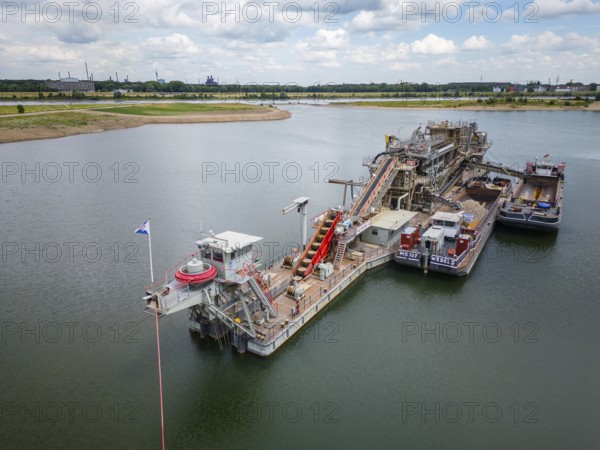 Gravel and sand extraction at the river Rhine using a gravel extractor
