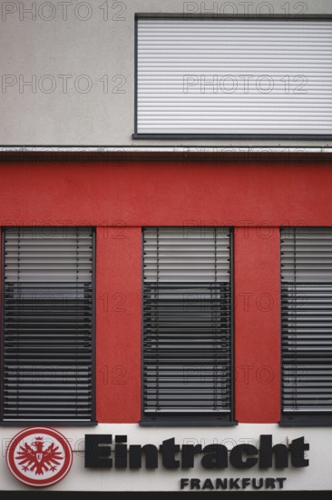 Frankfurt, Germany - August 05, 2017: The coat of arms of the Eintracht Frankfurt sports club on the facade of a club building on 05 August 2017 in Frankfurt, Germany, Europe