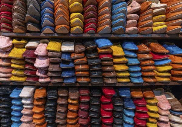 Fez, Morocco, 4 March, 2024: detail view of shelves full of colourful leather shoes and slippers in the medina of Fez near the Chouara Tannery, Africa