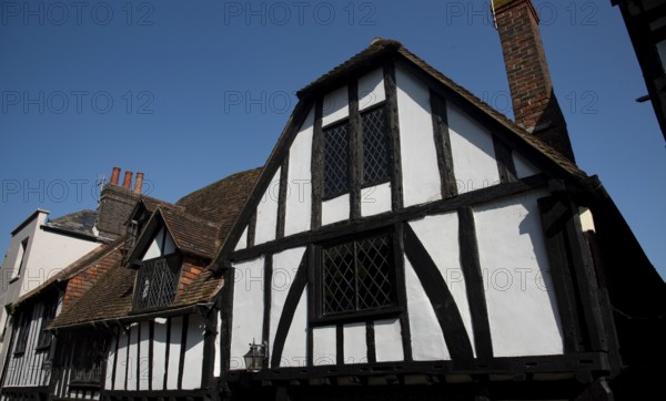 Wooden house roof attics against clear blue sky. Home residential building. Traditional british houses