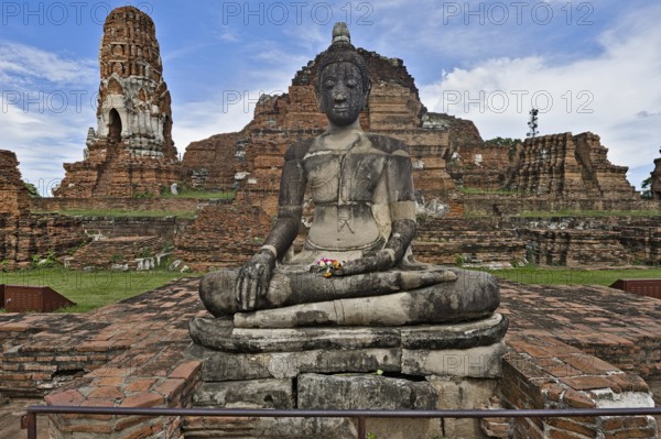 Wat Phra Mahathat temple complex in Ayutthaya on a sunny day