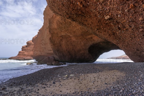 A view of the beach and rock arch at Legzira on the Atlantic Coast of Morocco