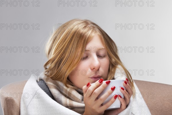 Young beautiful blonde ill woman, studio shoot