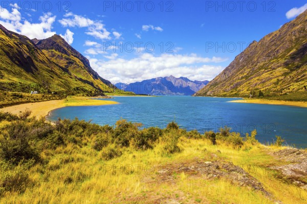 Great trip to a fabulous country. Huge Hawea Lake with turquoise smooth water. The steep slopes of the mountains descend into cold water. The concept of ecological, active and photo tourism
