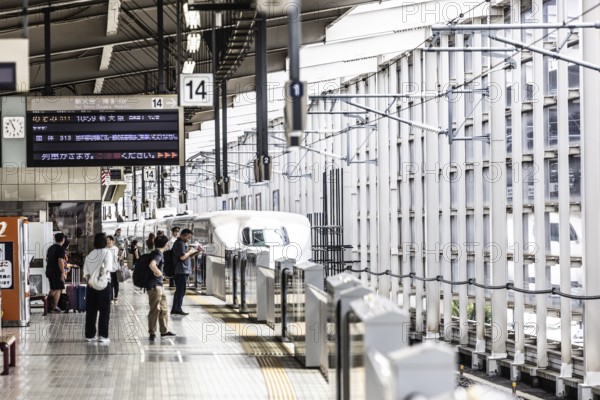 KYOTO, JAPAN - SEPTEMBER 24 2024: A Shinkansen high-speed bullet train arriving at Kyoto Station in Kyoto, Japan, Asia