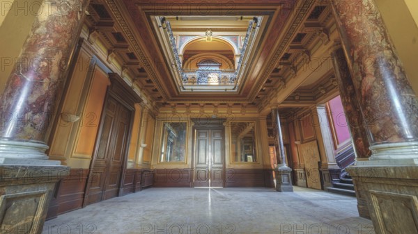 A magnificent corridor with marble columns and richly decorated ceilings in warm colours, Villa Woodstock, Lost Place, Brill, Wuppertal, North Rhine-Westphalia, Germany, Europe