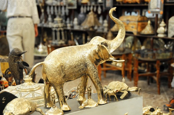 Brass figures at a market, including an elephant and other animal sculptures, Fez, northern Morocco, Morocco, Africa