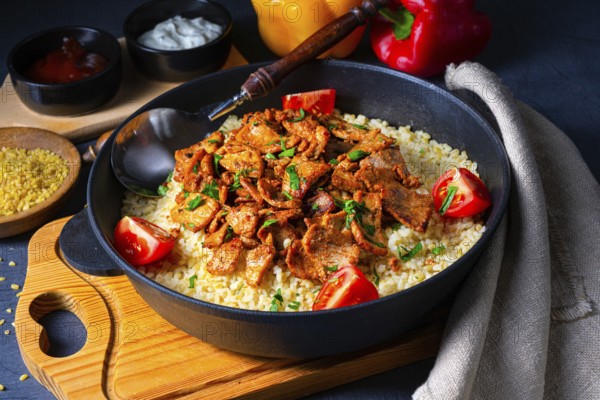 Rustic Wulgur pans with gratinated gyros and yoghurt