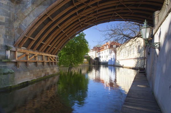 Kampa Island, also known as Venice of Prague, in the Mala Strana, the old houses are reflected in the narrow river Devil (Czertovka). The old watermill .Czech Republic, Prague