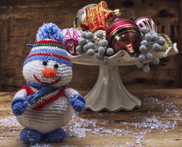 Photo knitted from wool figurine Christmas snowman