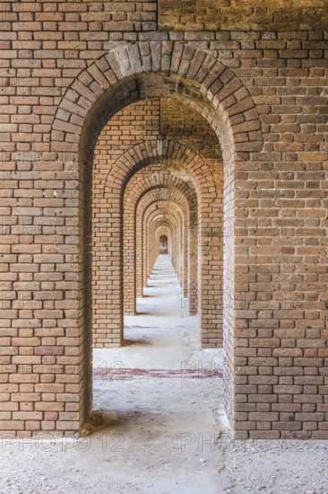 A series of brick arches inside Fort Jefferson. Fort Jefferson is a military historical fortress in the Dry Tortugas National Park, Florida