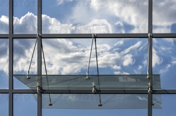 Clouds reflected on the house facade