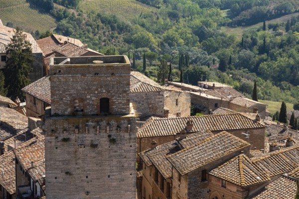 Wide panoramic view over downtown San Gimignano, Torre del Diavolo in the center, seen from Torre Grosso, Italy, Europe