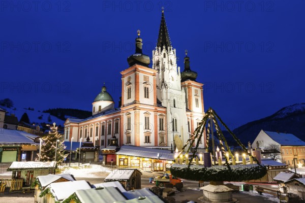 Advent atmosphere, world's largest hanging Advent wreath at the Christmas market in front of the basilica of Mariazell, blue hour in the early morning, Mariazell, Styria, Austria, Europe
