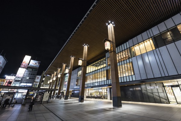 NAGANO, JAPAN - SEPTEMBER 17 2024: The beautiful architecture of Nagano Train Station at night in Nagano, Japan, Asia