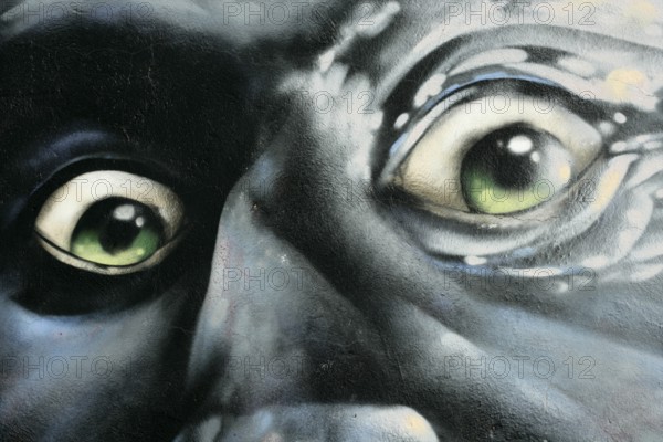 Portrait of angry man, graffiti over concrete, red, gray, green