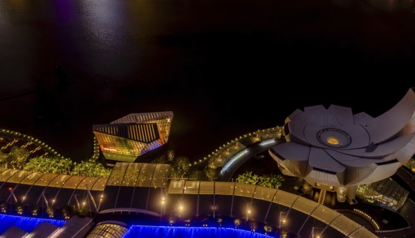 Singapore City, Singapore, January 23, 2019: Night aerial view of ArtScience Museum and Louis Vuitton building at Marina Bay, Asia