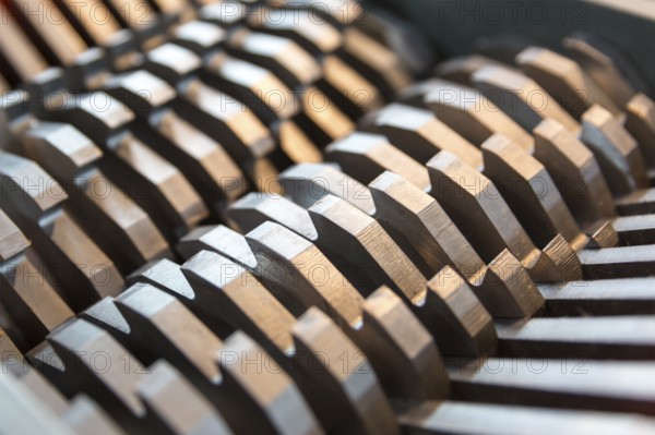 Metal blades of a chopper machine. New sharp blades made of hardened steel. Ready to cut anything. Closeup