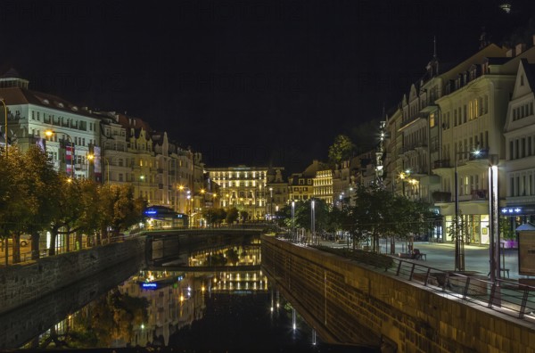 Embankment of Tepla river in the center of Karlovy Vary in evening, Czech republic