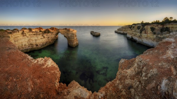 Praia de Estaquinha, Portuguese coast near the city of Lagos in the light of the setting sun