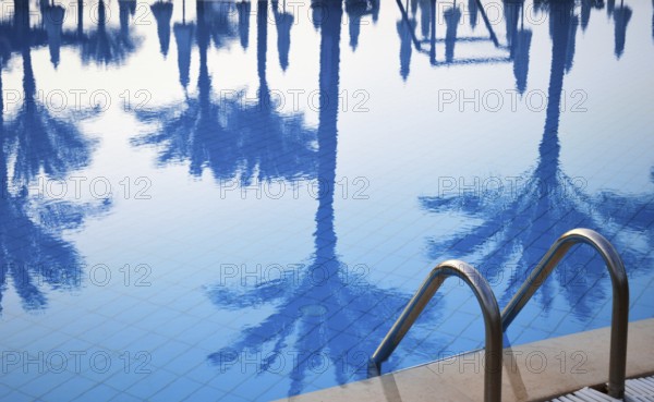 Swimming pool in touristic resort during summer time