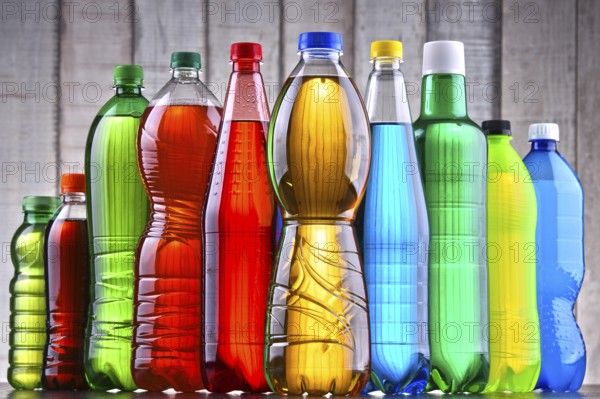Plastic bottles of assorted carbonated soft drinks in variety of colors