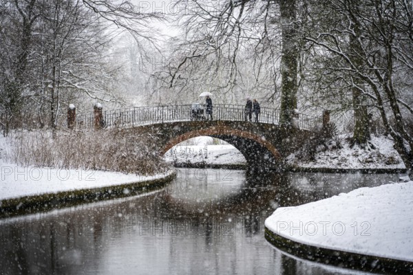 Copenhagen, Denmark, January 06, 2021: People enjoying a snowy winter day in Frederiksberg Gardens, Europe