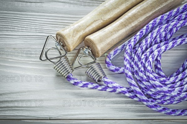 Skipping rope on wooden board Sports training concept