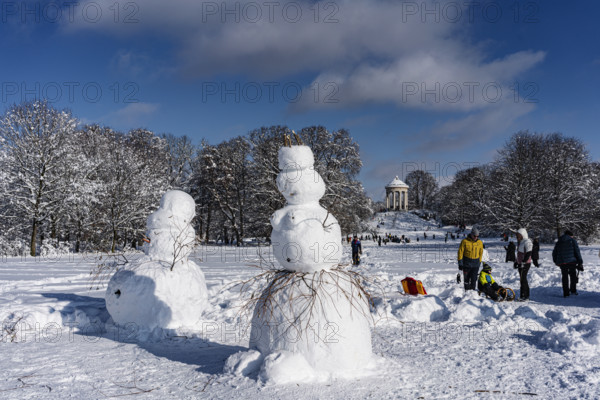 Snowman and snowwoman, behind Monopteros, winter with snow in the southern part of the English Garden, Munich, Bavaria, Germany, Europe
