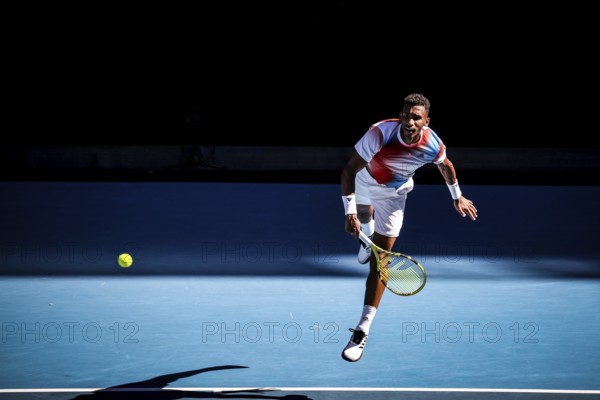 MELBOURNE, AUSTRALIA, JANUARY 24: Felix Auger-Aliassime of Canada on his way to beating Marin Cilic of Croatia on day 8 of the 2022 Australian Open at Melbourne Park on January 24, 2022 in Melbourne, Australia, Oceania