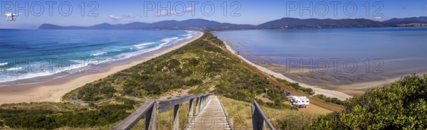 The Neck lookout on Bruny Island provides panoramic views over scenic North and South Bruny Island Beaches on the island in Tasmania, Australia. A drone is flying in the top left corner