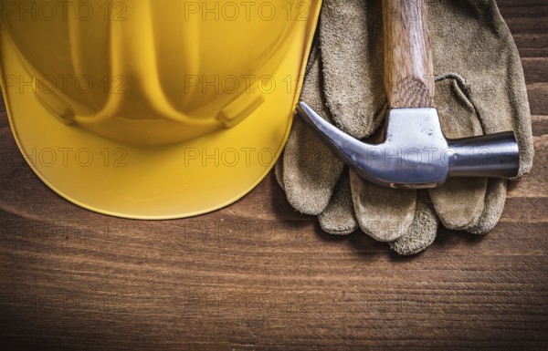 Claw hammer building helmet protective gloves construction concept