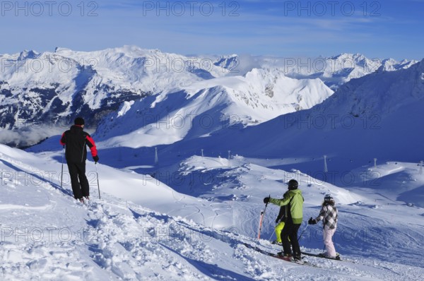 Magnificent view from the popular winter sports region Davos Parsenn Weisfluhjoch | Panoramic swiss alps mountain view from Weissfluhjoch above the famous Swiss Alps Wintersport region Davos-City