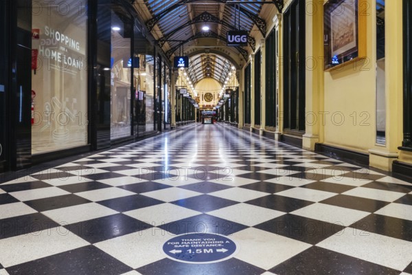Melbourne, Australia, August 17, 2020: Collins St within Melbourne CBD is quiet and deserted during the Coronavirus pandemic. Melbourne is currently under Stage 4 lockdown and night curfew after a 2nd wave of infections, Oceania