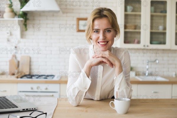 Business woman sitting with coffee cup laptop