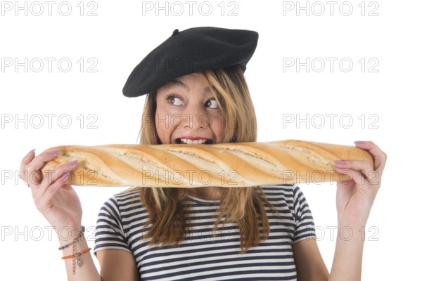 Young French girl with typical French barret and striped shirt eating bread isolated over white background